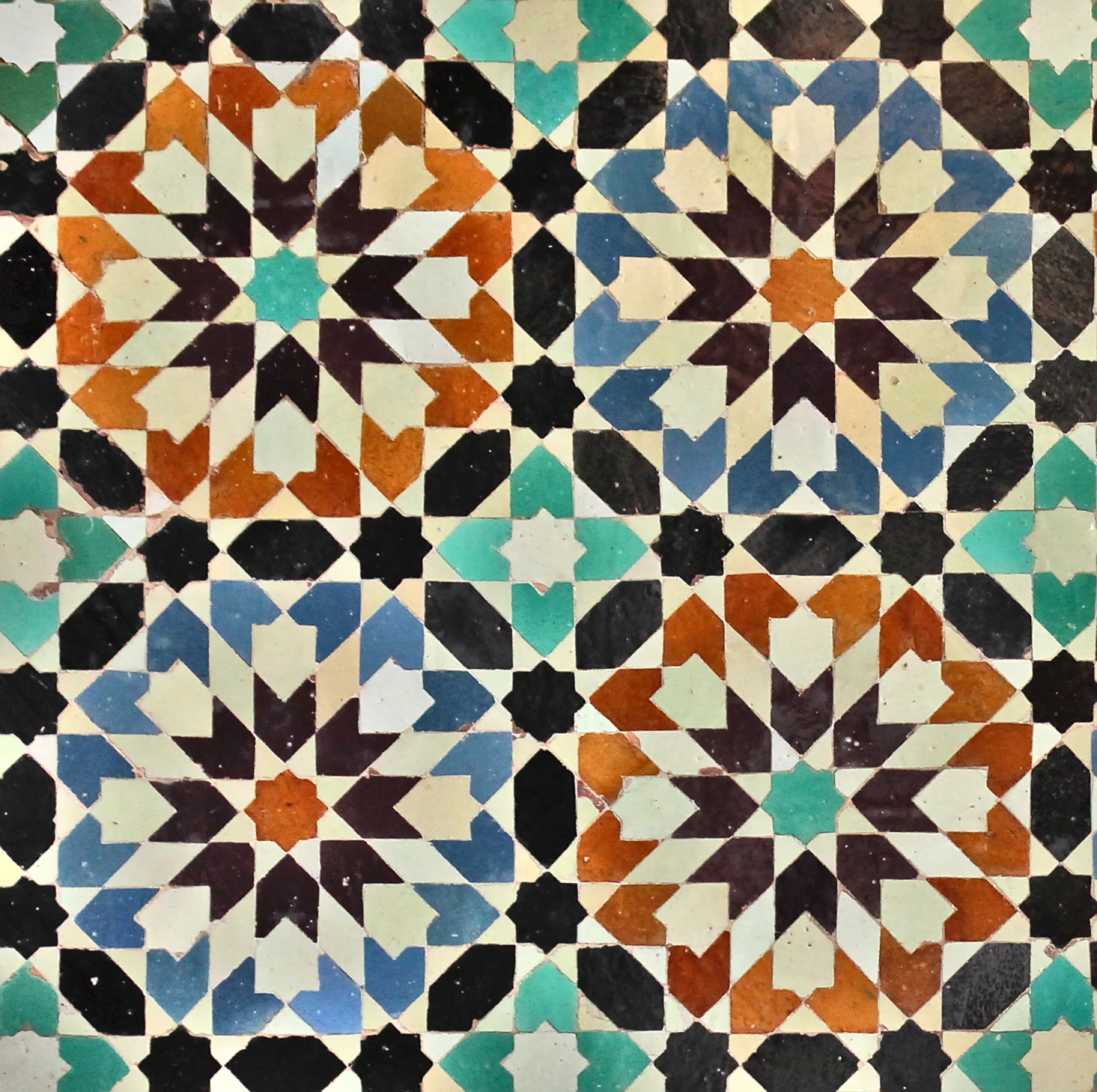 Zellige mosaic tilework detail in the Medersa Ben Youssef